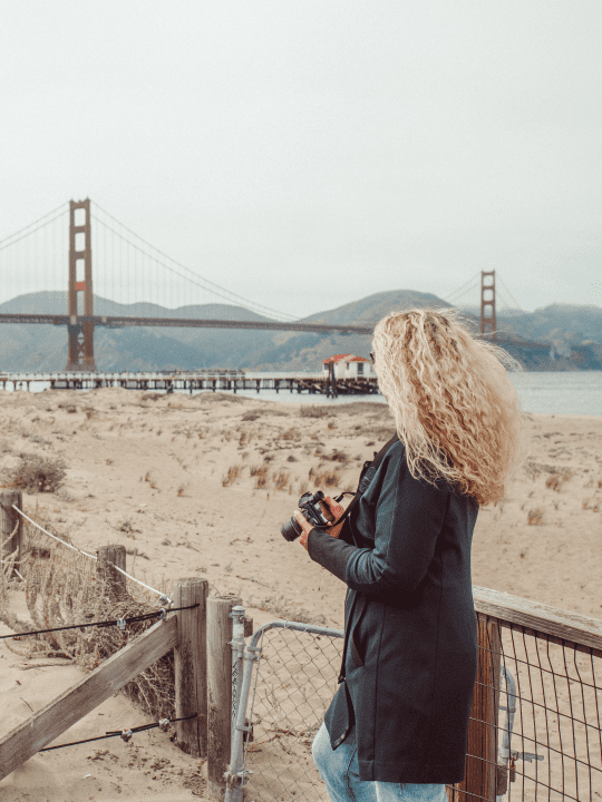 Carrie Green Zinn taking pictures near the Golden Gate Bridge