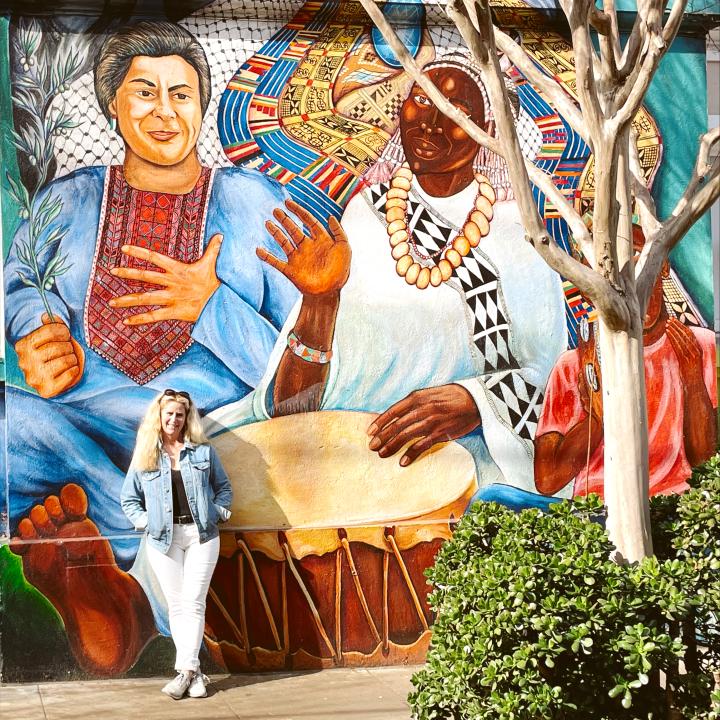 Carrie Green Zinn in front of a Mission District Murals in San Francisco