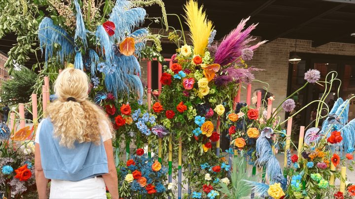 Carrie Green-Zinn looking at a flower display in the meatpacking district in NYC