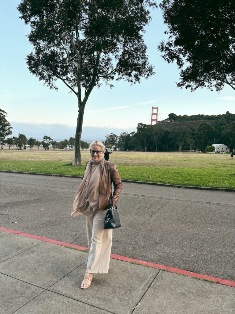 Carrie Green-ZInn at Cavallo Point with the golden Gate Bridge behind her.
