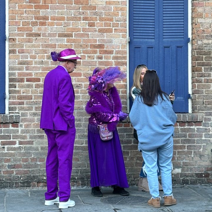 A couple in their purple Mardi Gras attire in New Orleans in January