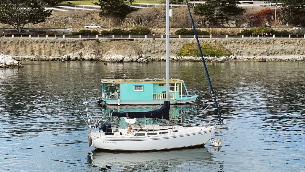Two boats in the harbor at Old Fisherman's Wharf in Monterey, CA.