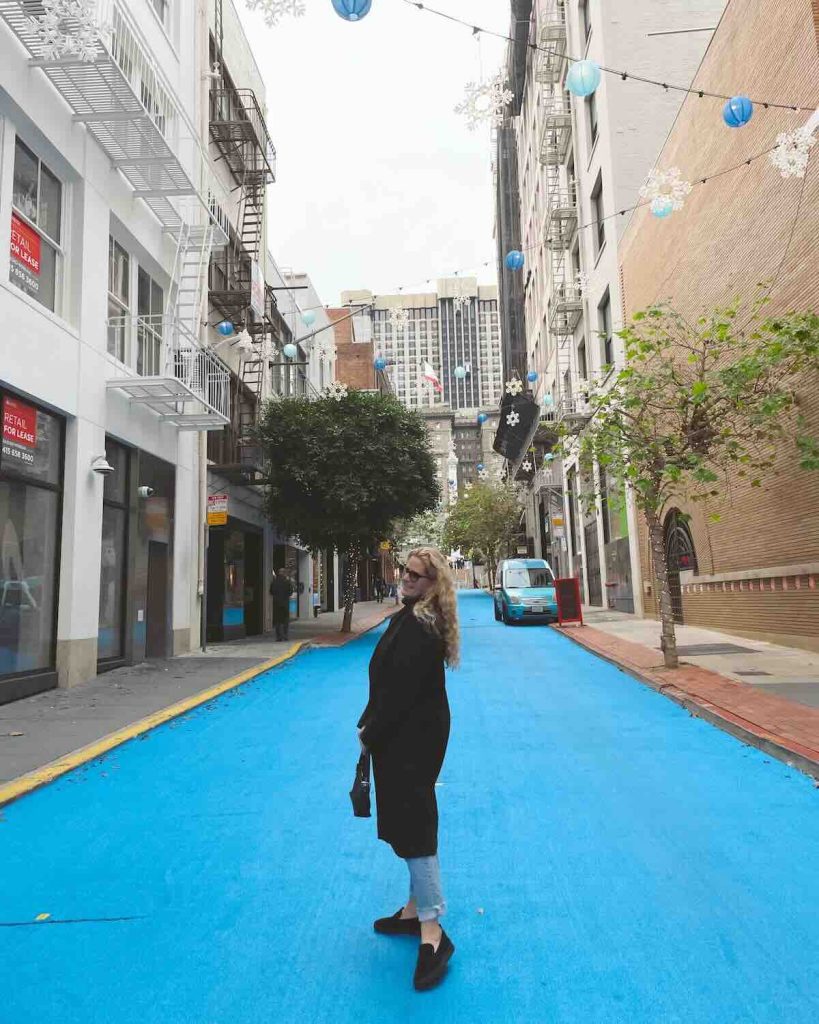 Carrie Green-Zinn on the blue pavement of Maiden Lane at Union Square- one of the places to go on 3 days in San Francisco