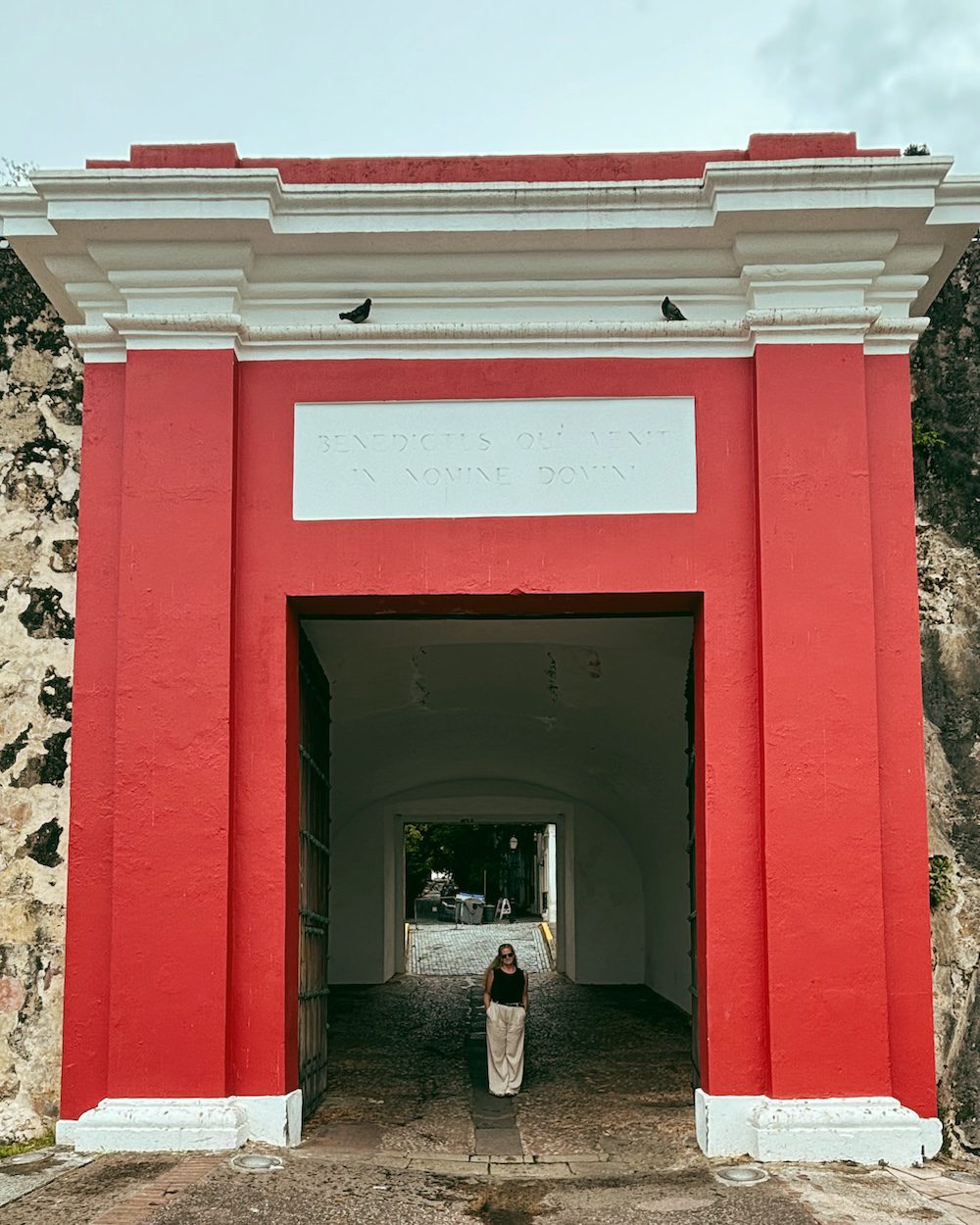 Carrie Green-Zinn standing in the San Juan Gate which is one of the things to do in Old San Juan