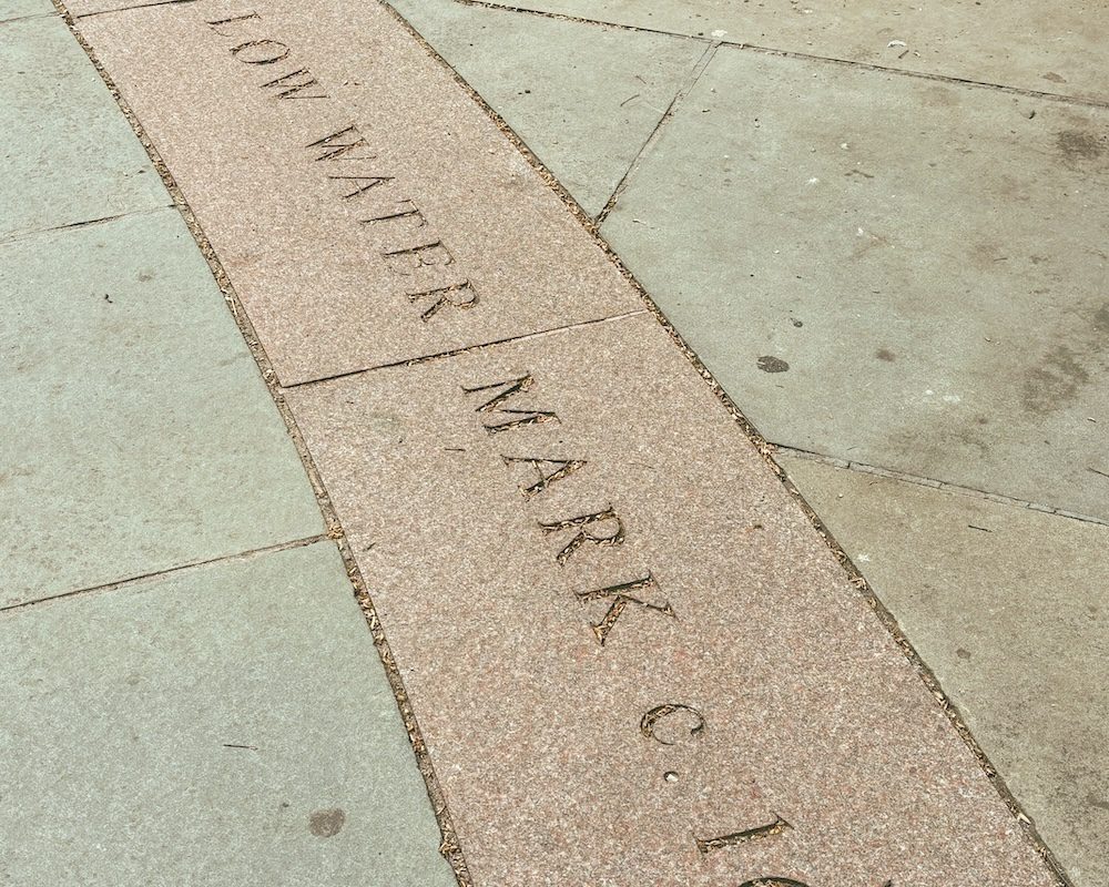 A marking of the water table on a time line by the Titanic Memorial in NYC.