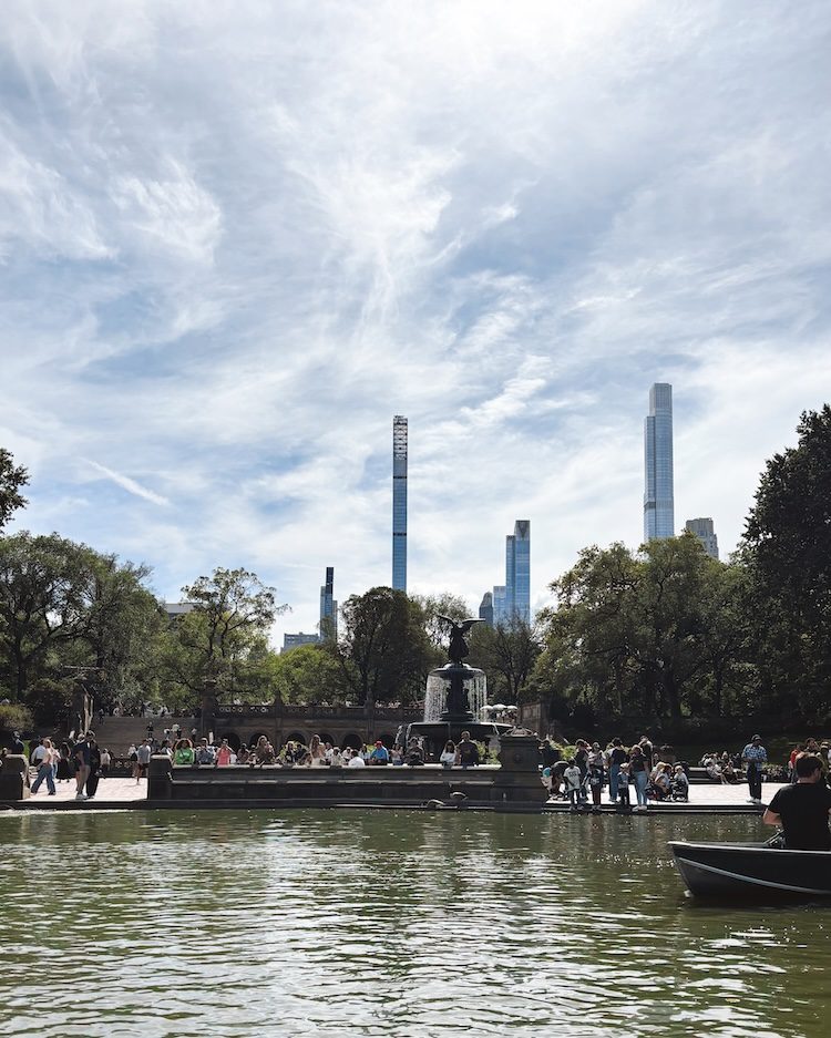 A view from a row boat in the lake in Central Park looking at the Bethesda Fountain