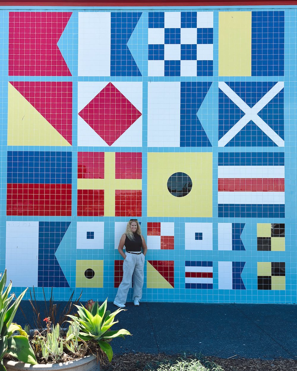 Carrie infant of the sailing flag wall in Sausalito