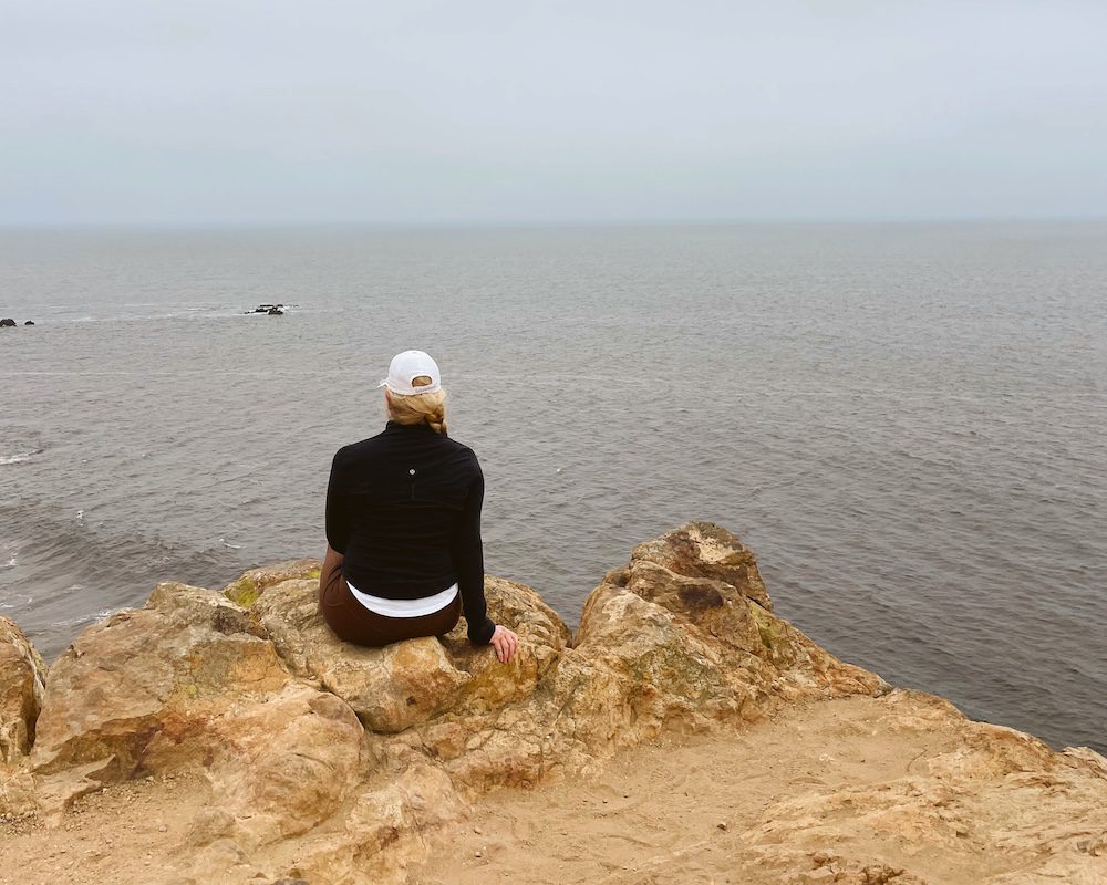 Carrie Green-Zinn on a cliff above Zuma Beach in Malibu