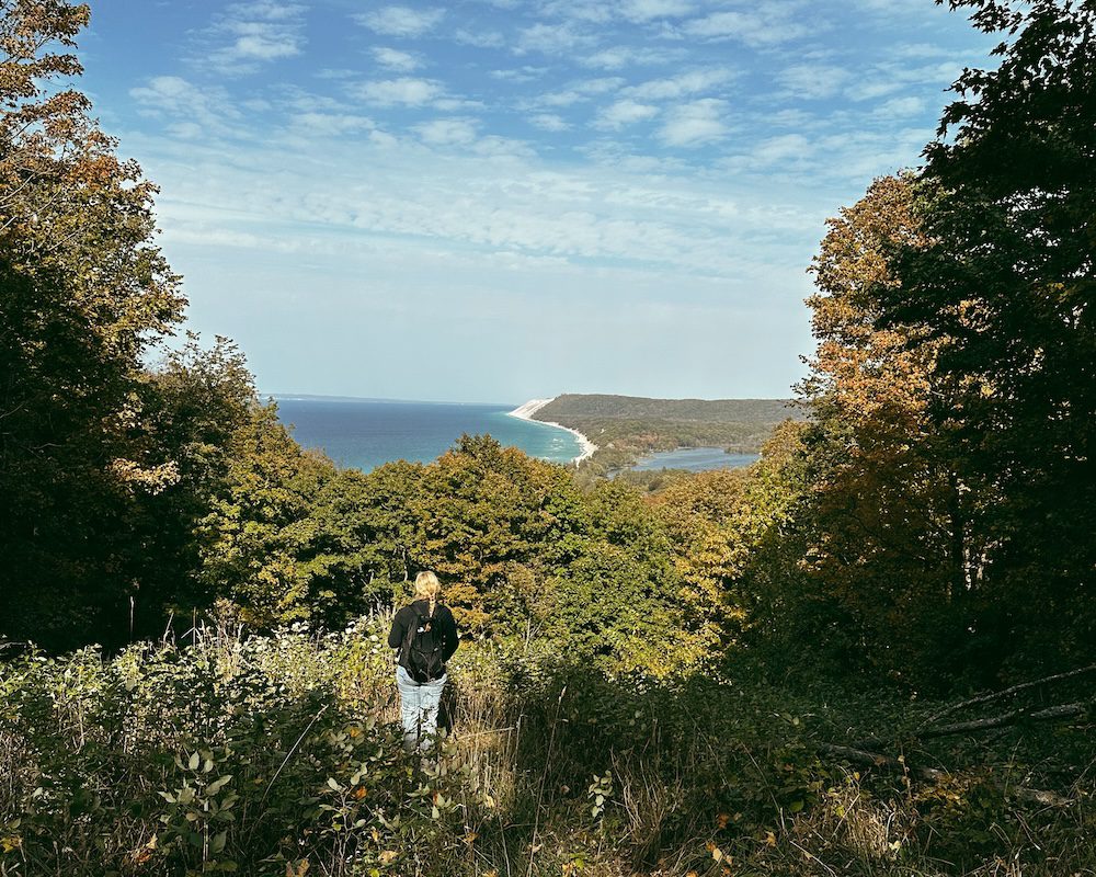 Carrie Green-Zinn overlooking a view at Sleeping Bear National Lakeshore