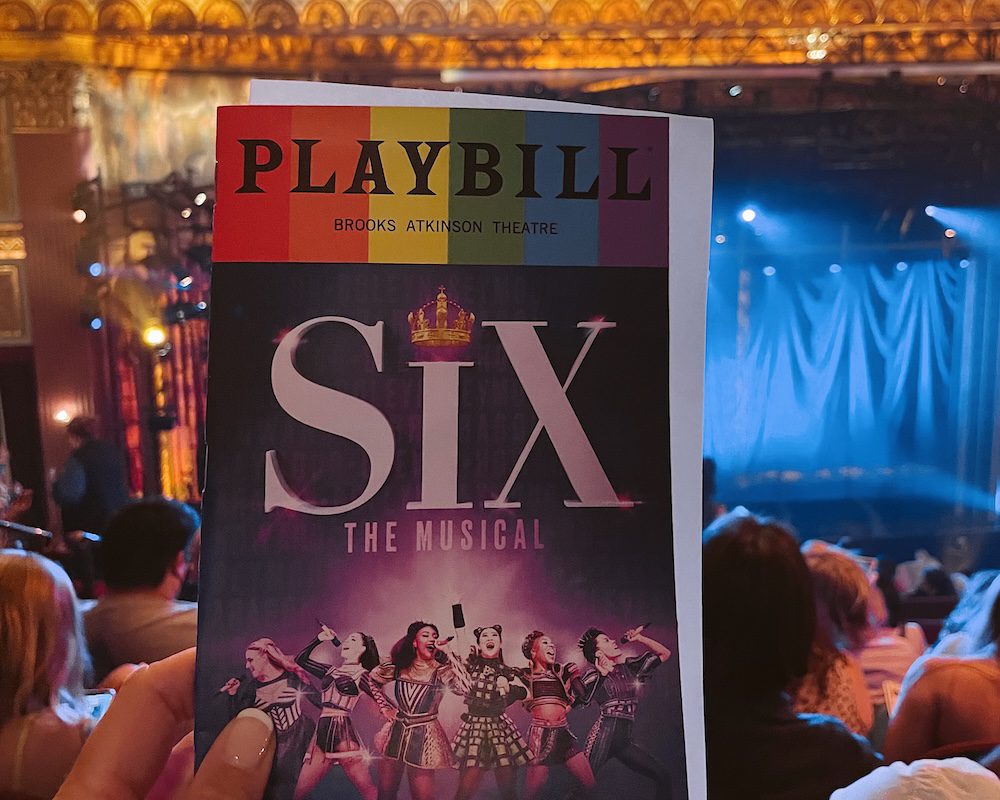 A playbill from the musical Six on Broadway in NYC.