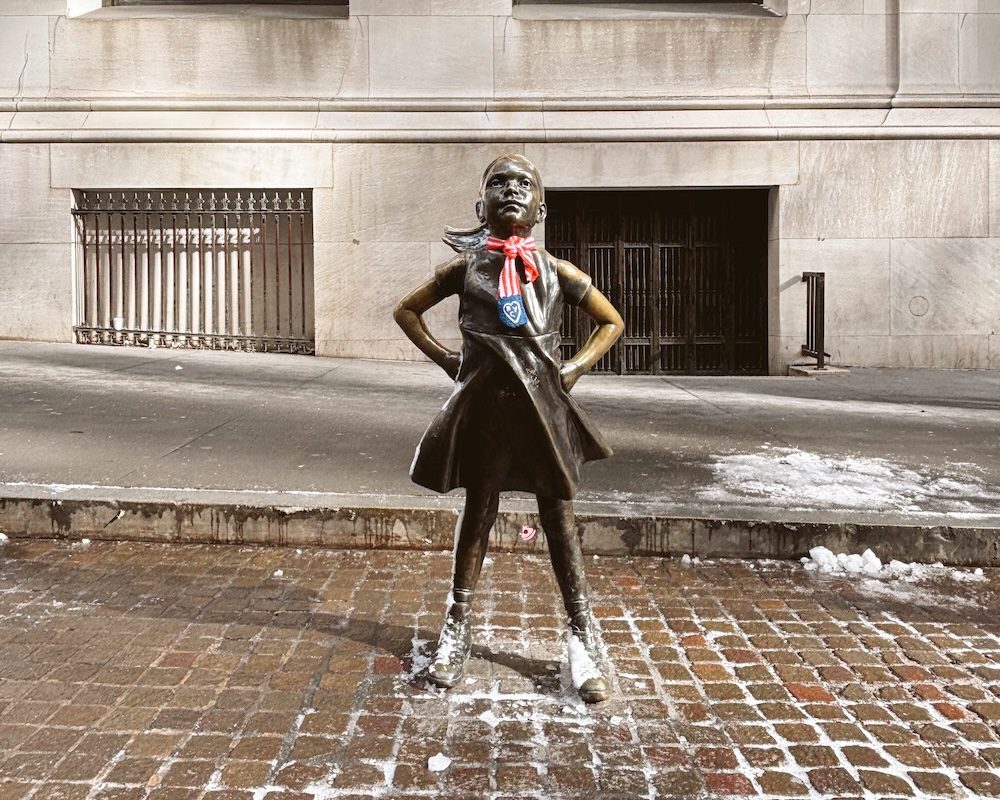 The Fearless Girl Statue in front of the New York Stock Exchange
