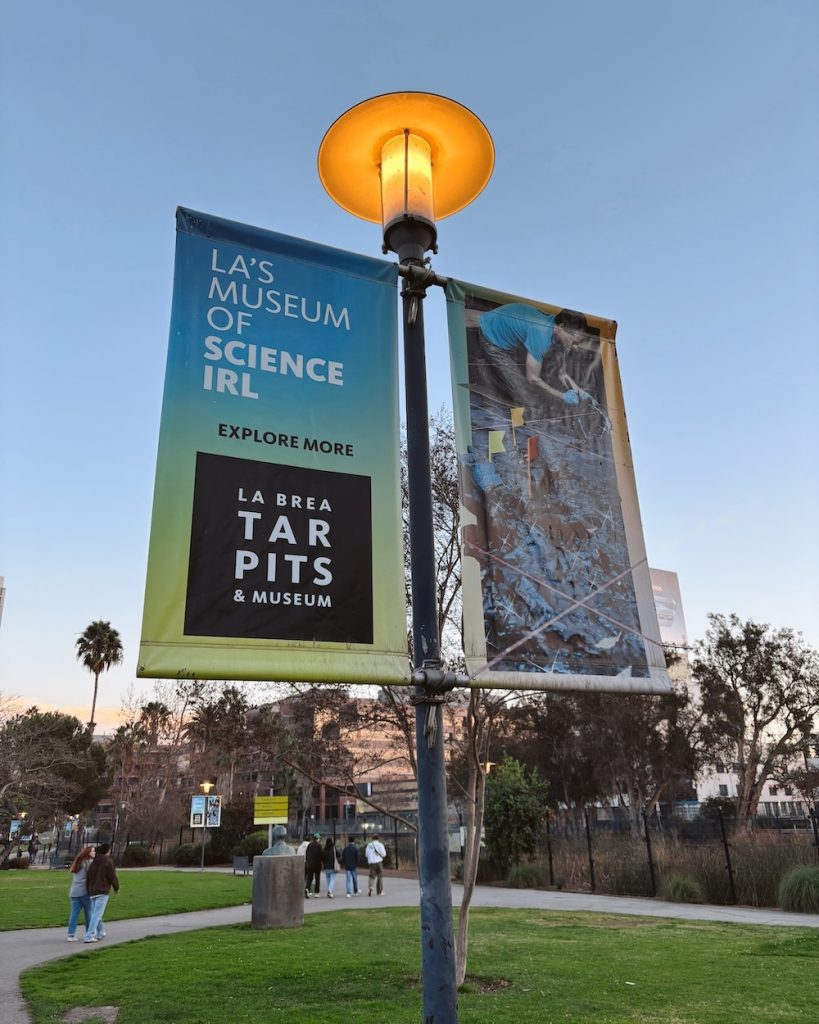 The welcome signs in the park to the La Brea Tar Pits in Los Angeles