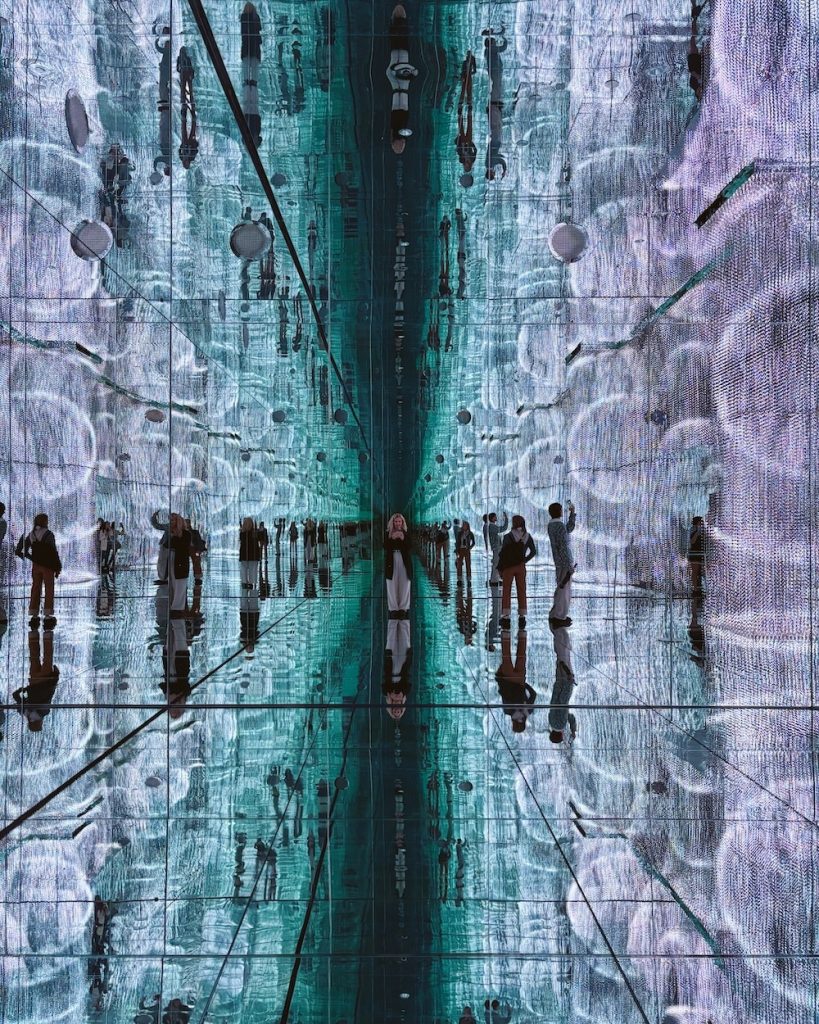 Carrie Green-Zinn in one of the light and music exhibits in Mercer Labs in New York City - a room filled with mirrors and colors that move as the music changes.