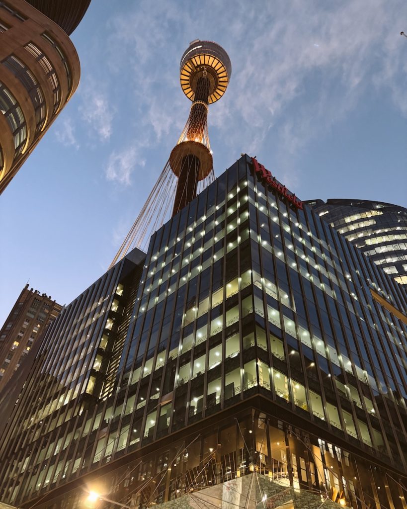 A view of the Sydney Tower lit up at night