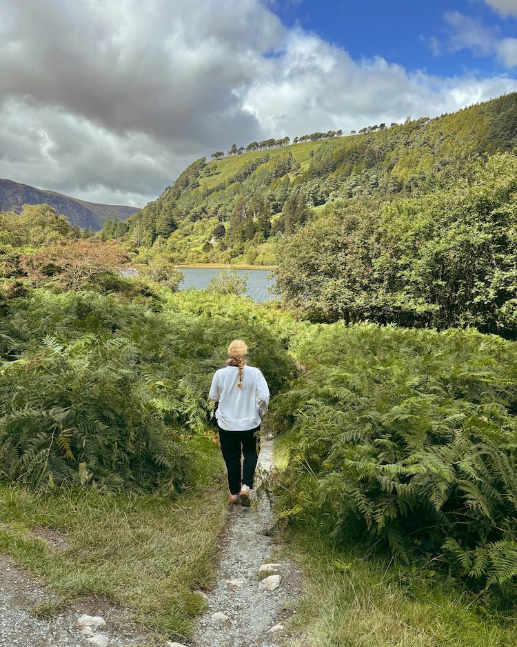 Carrie Green-Zinn wearing Athleta pants in a glen in Ireland