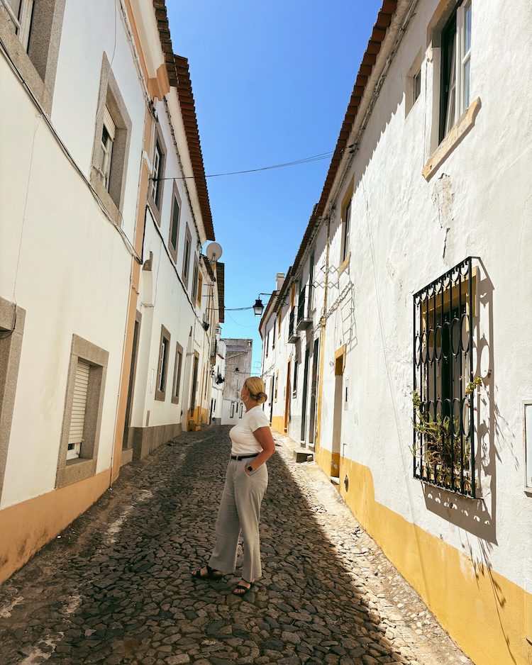 Carrie Green-Zinn on a street in Evora, Portugal.
