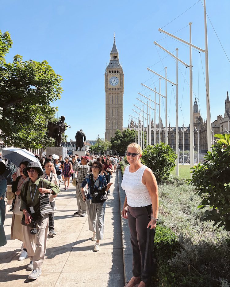 Carrie Green-Zinn in front of the Houses of Parliament in London