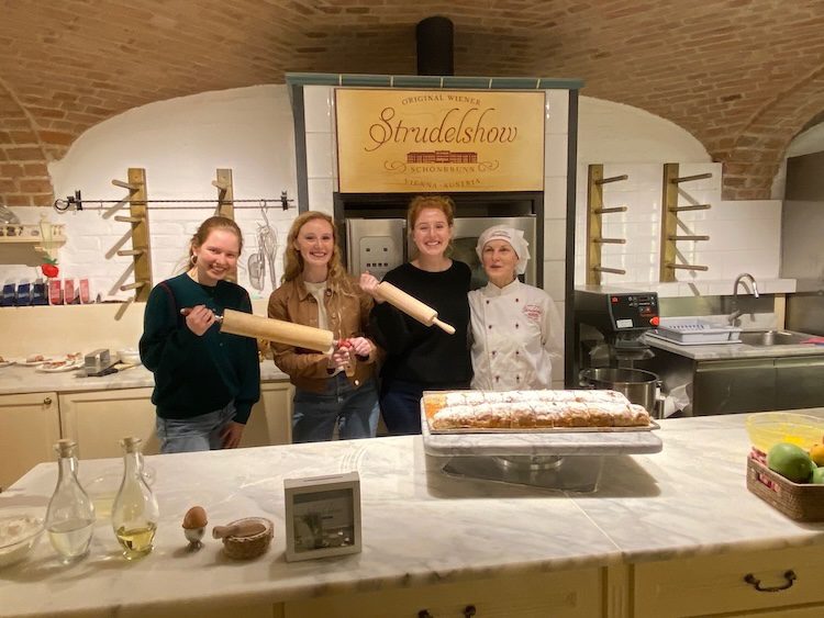 Carrie Green-Zinn's daughters and niece  at the Strudel Show in Vienna with the pastry chef.
