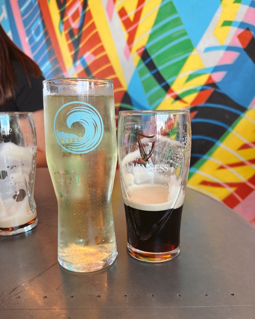 A pint of Guinness and a glass of cider at the Guinness Warehouse in Dublin, Ireland