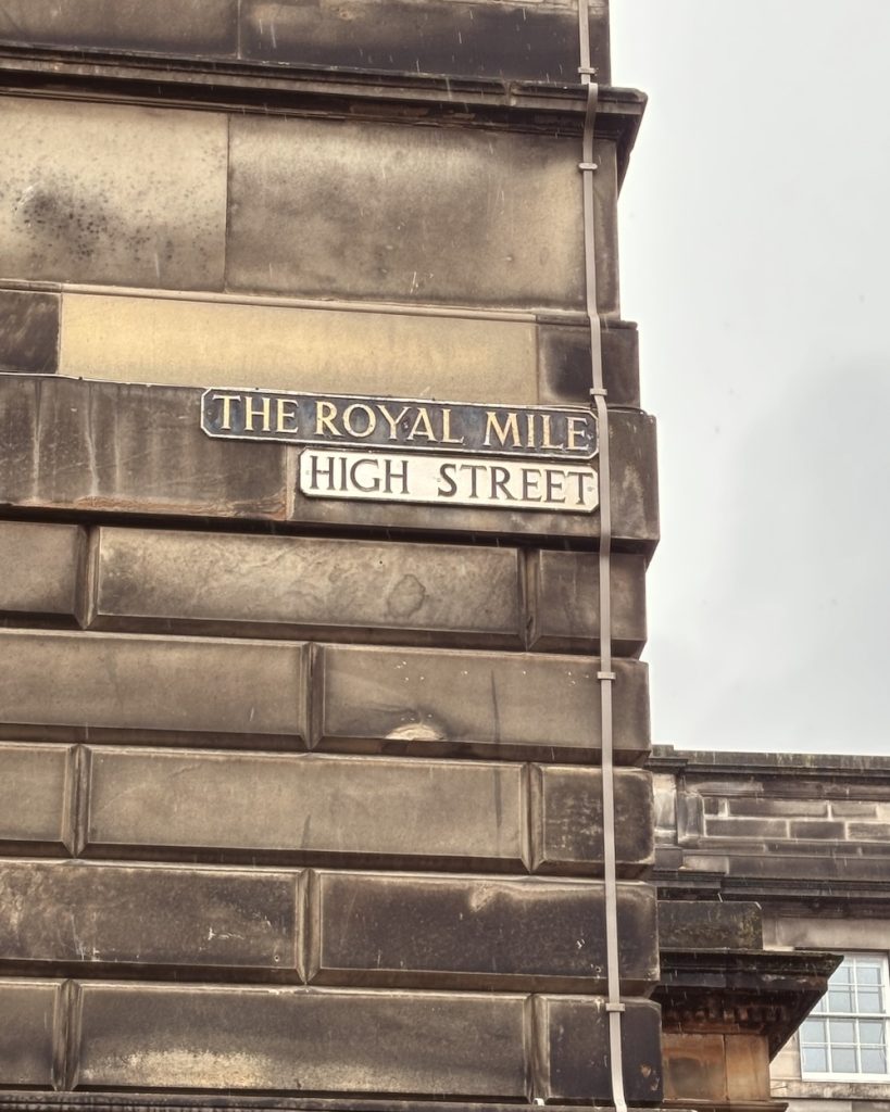 The sign on the corner of High Street on the Royal Mile in Edinburgh